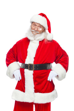 Christmas. Santa Claus put his hands on his belt. Isolated on white background.