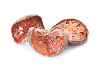 Aegle marmelos. Dry bael fruit isolated on white background.Dried herbs and dried bael fruit drink Healthy and Natural Food concept