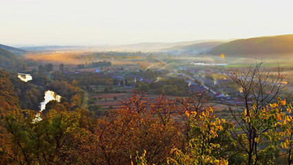 Obraz premium Landscape in autumn the mountain morning a fog on the mountain