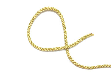 close up of gold rope on white background