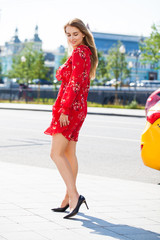 Bautiful blonde in sexy red dress