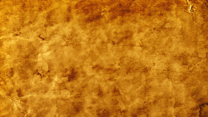 Antique texture, old grungy background and vintage parchment concept with grunge image of blank yellow aged paper with dirty stained marks with copy space