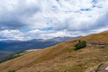 Fototapeta na wymiar hikers walking along trail in Rocky Mountain National Park