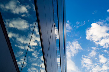 Fototapeta na wymiar sky reflecting on building