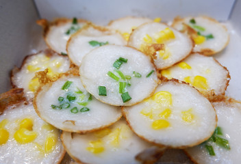 Kanom Krok - Kind of Thai sweetmeat , Thai dessert,  made from flour sugar and coconut milk, Sprinkled with spring onion and corn.