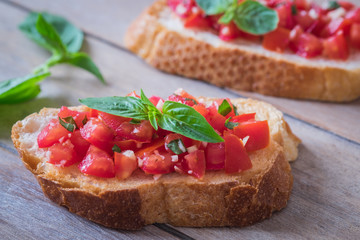 Bruschetta bread with chopped tomato and basil