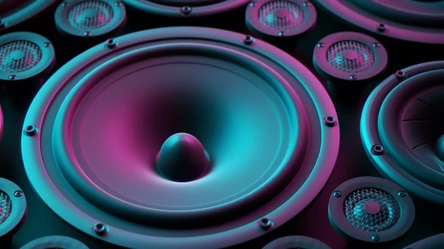 Playing speaker membranes stacked in endless loop. Lit by colourful retro lights