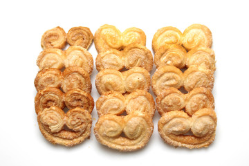 Typical sweet cookies from Argentina called palmeritas. Shot taken on a white background