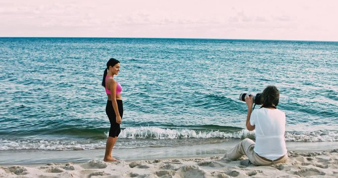 Female photographer dooing photoshoot at the beach.