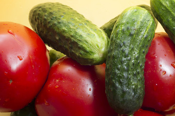 tomato and cucumber on a plastic bowl