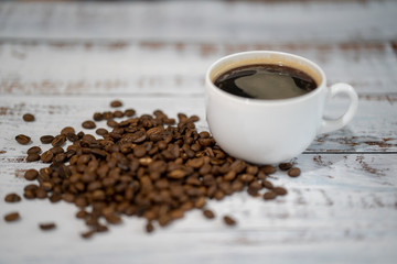 Cup of fresh hot coffee on blue wooden background, top view, coffee time
