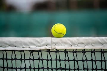 The beginning of a champion, Close up tennis ball on the courts background.