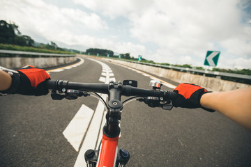 Free rider Cyclist Riding Mountain Bike on highway