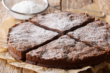 kladdkaka chocolate dessert pastry with powdered sugar close-up. horizontal