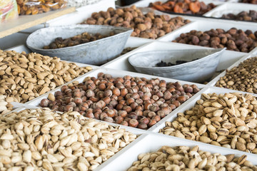 Fototapeta premium Dried fruits and nuts on local food market in Tashkent, Uzbekistan