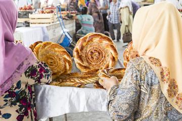 Traditional uzbekistan bread lavash at local bazaar, is a soft flat-bread of Middle Asia (Uzbekistan).