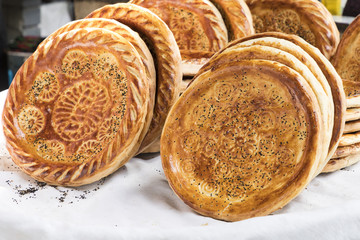 Traditional uzbekistan bread lavash at local bazaar, is a soft flat-bread of Middle Asia (Uzbekistan).