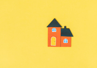 Orange house on yellow background.