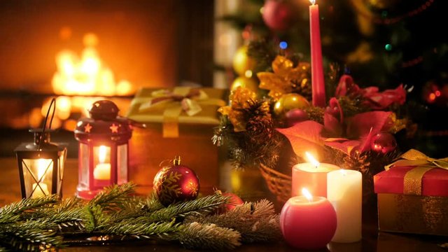 4k background with burning firepalce, Christmas tree and candles at New Years eve