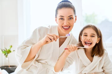 family are brushing teeth