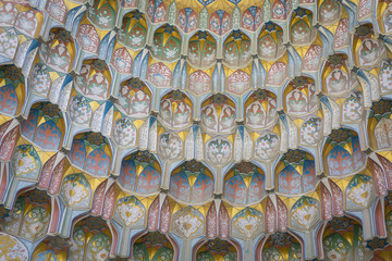 Decorative patterns and architectural details at the main entrance of Abdullaziz Khan madrasah in Bukhara, Uzbekistan