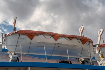 Lifeboat installed on passenger liner deck.