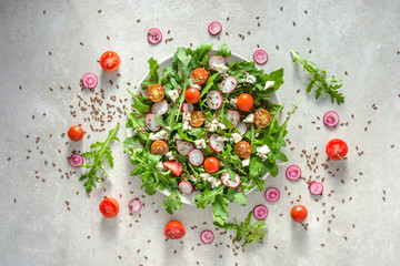 Healthy vegetable salad with fresh vegetables, vegetarian food on plate, top view