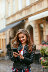 Woman Using Phone On Street 