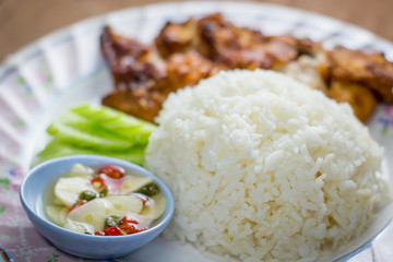 Fried Chicken and Rice in Plate on Wooden Floor ,fast food,in thailand