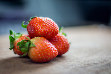 Red strawberry on wooden floor