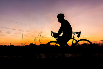 Silhouette of Men's Cycling At sunset