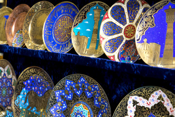 Plates and pots on a street market in the city of Bukhara, Uzbekistan.Traditional souvenir.