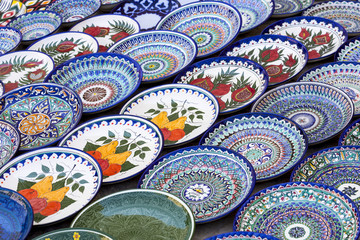 Plates and pots on a street market in the city of Bukhara, Uzbekistan.Traditional souvenir.