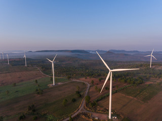 Aerial view of wind turbine sunset. Sustainable development, environment friendly, renewable energy concept.