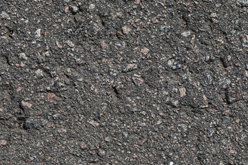 Texture of asphalt with granite chips, top view