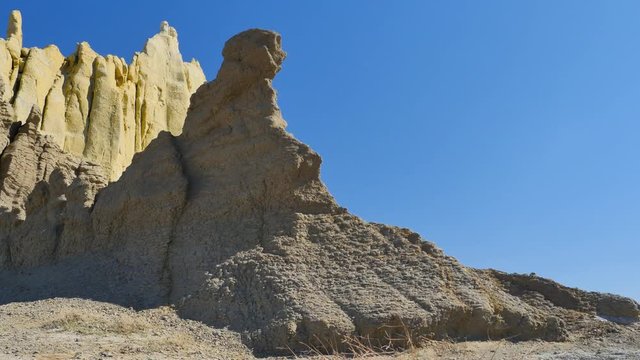 Valley of Castles chalky sphinx rock in Kasakhstan. Sunny midday 4K tracking shot of the Airakty-Shomanai mountains.