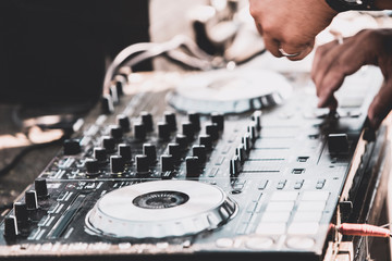 Naklejka na ściany i meble Dj mixing at beach party in summer