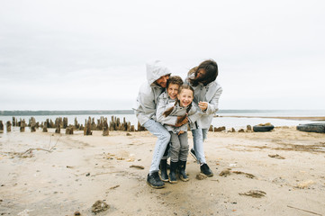 a young family have a fun near the sea on a boat background