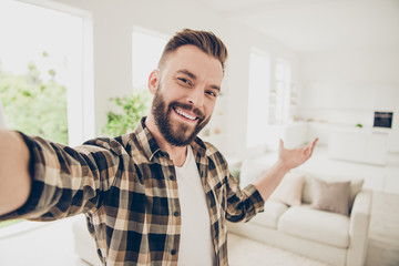 Welcome Brunet man take selfie on front camera of modern smartp