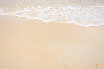 Fototapeta na wymiar sand of beach and soft wave backgroun