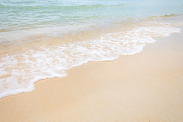 Fototapeta na wymiar sand of beach and soft wave backgroun
