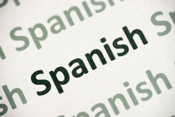 word Spanish language printed on paper macro