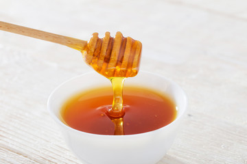 honey on white wooden table