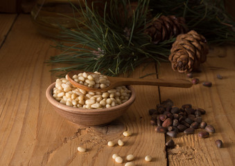 Cedar nuts and cones on wooden table