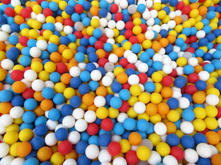 Colorful plastic balls on kids playground. Balls for fun and jumping, multi-colored festive background