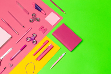 school supplies at colorful paper background