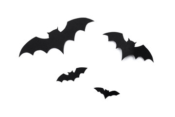 halloween and decoration concept - paper bats flying