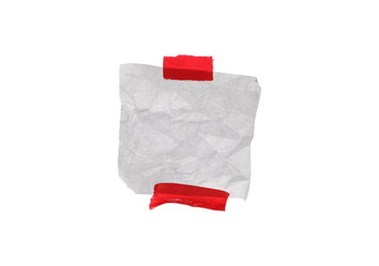 Crumpled paper with red tape isolated on white background, clipping path