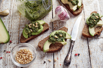 Sandwich with pesto sauce and avocado