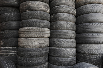 Pile of old used rubber tyres